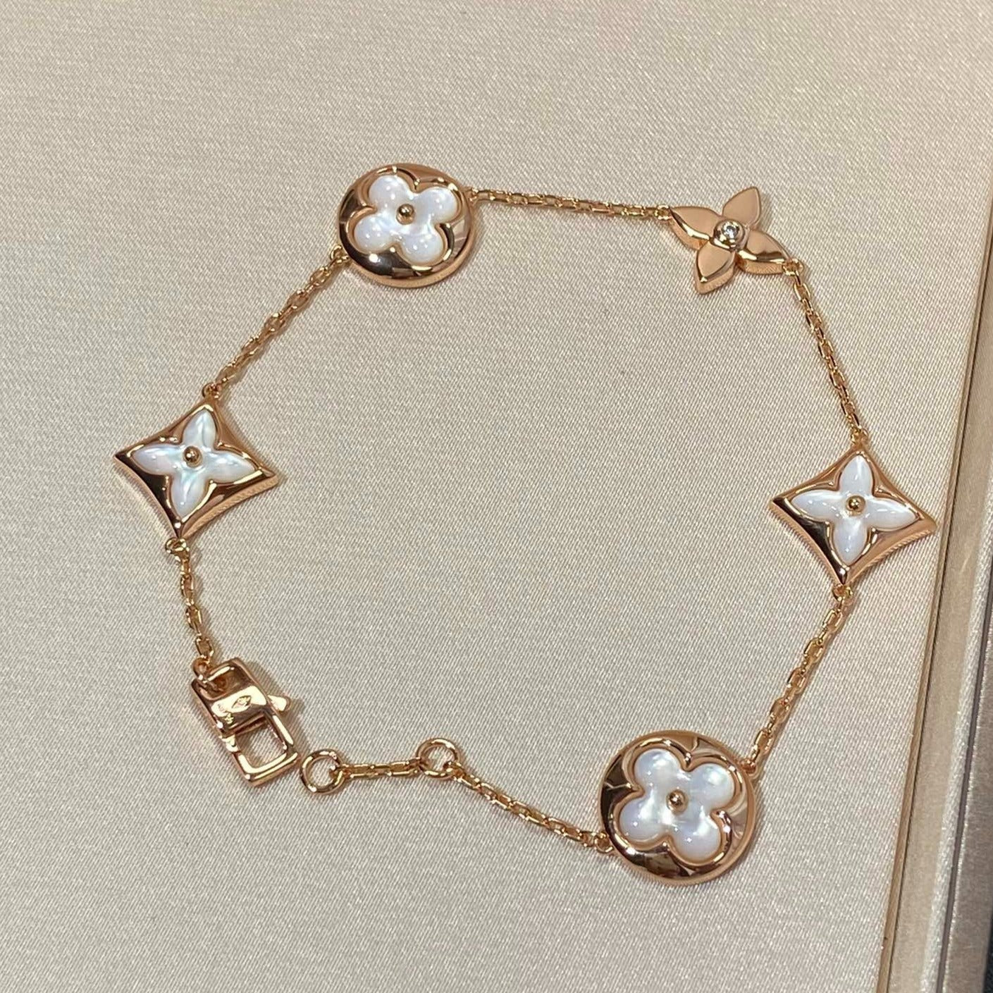 [Jesse jewelry]STAR AND SUN 5 MOTIF MOP PINK GOLD BRACELET